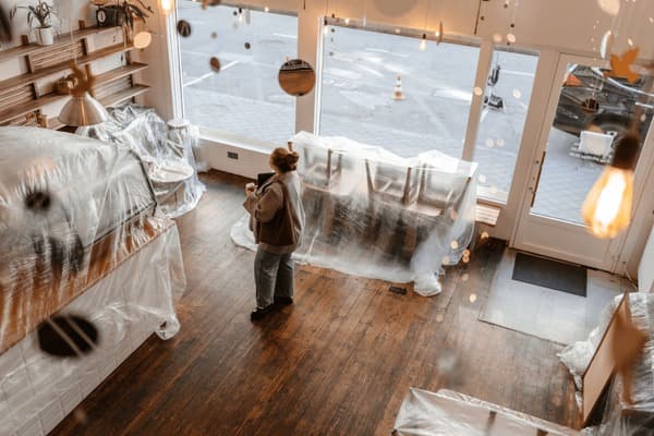 Business owner standing inside their store representing growth with merchant funding